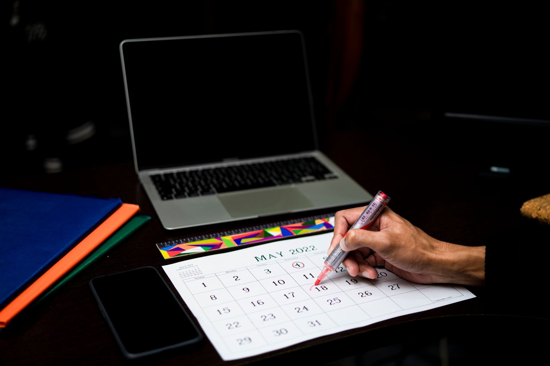A Person Marking a Day in A person marking a day in a calendar on UCSTAK's Book a Meeting page.