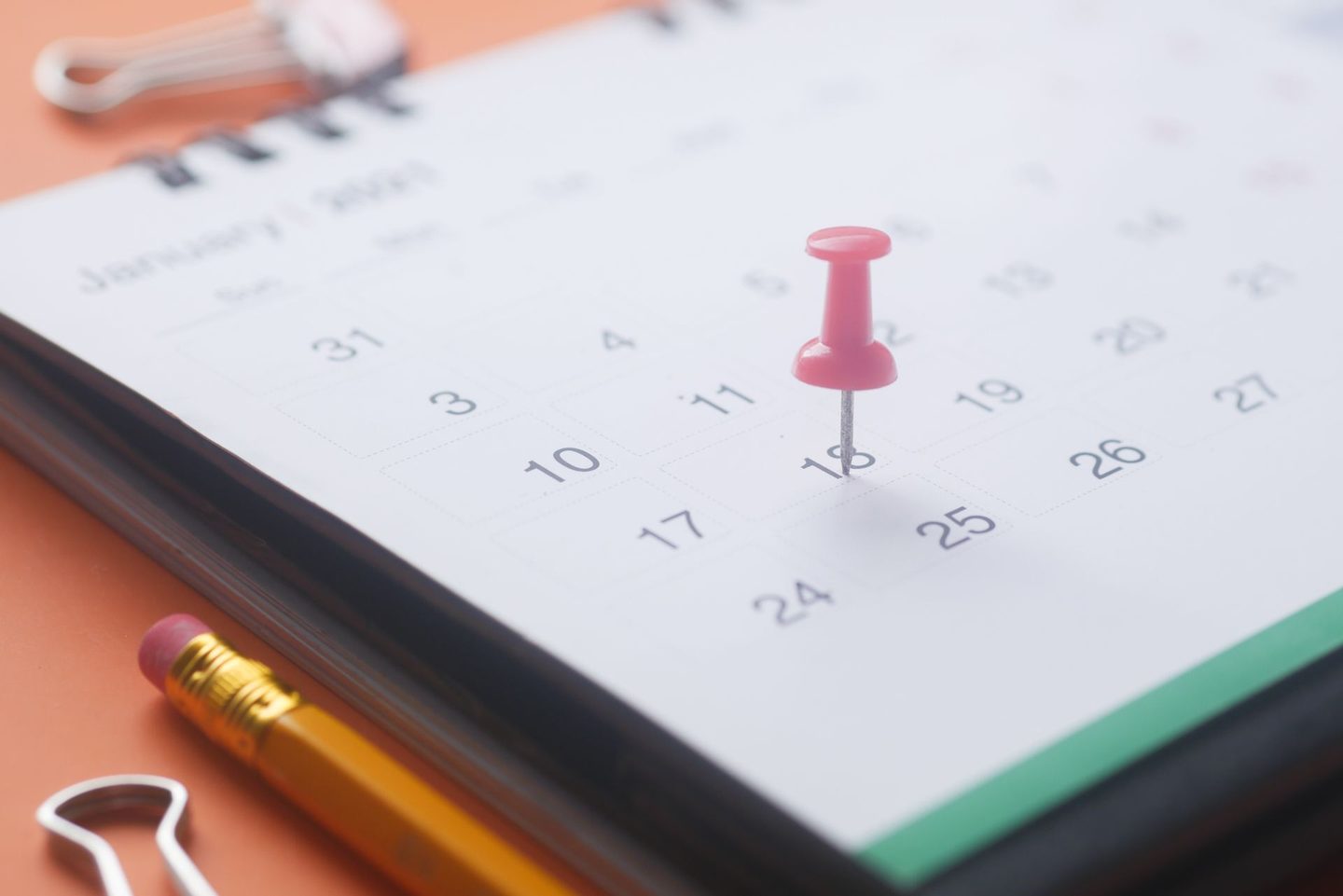 Pink Push Pin on a Calendar Pink push pin on a calendar, representing UCSTAK's Holiday & Exception Schedules feature.