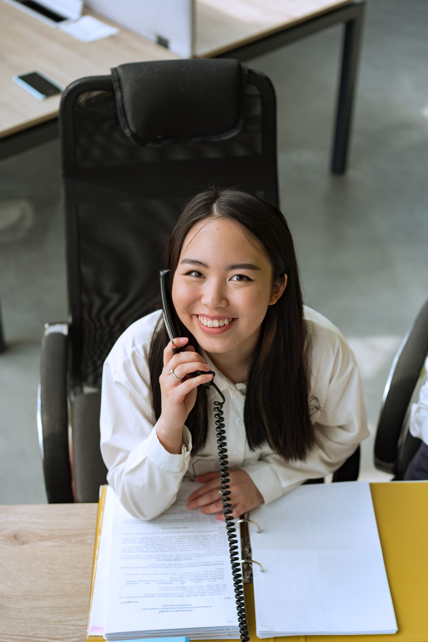 Woman talking on the phone, representing UCSTAK's Menu Call Recording feature.