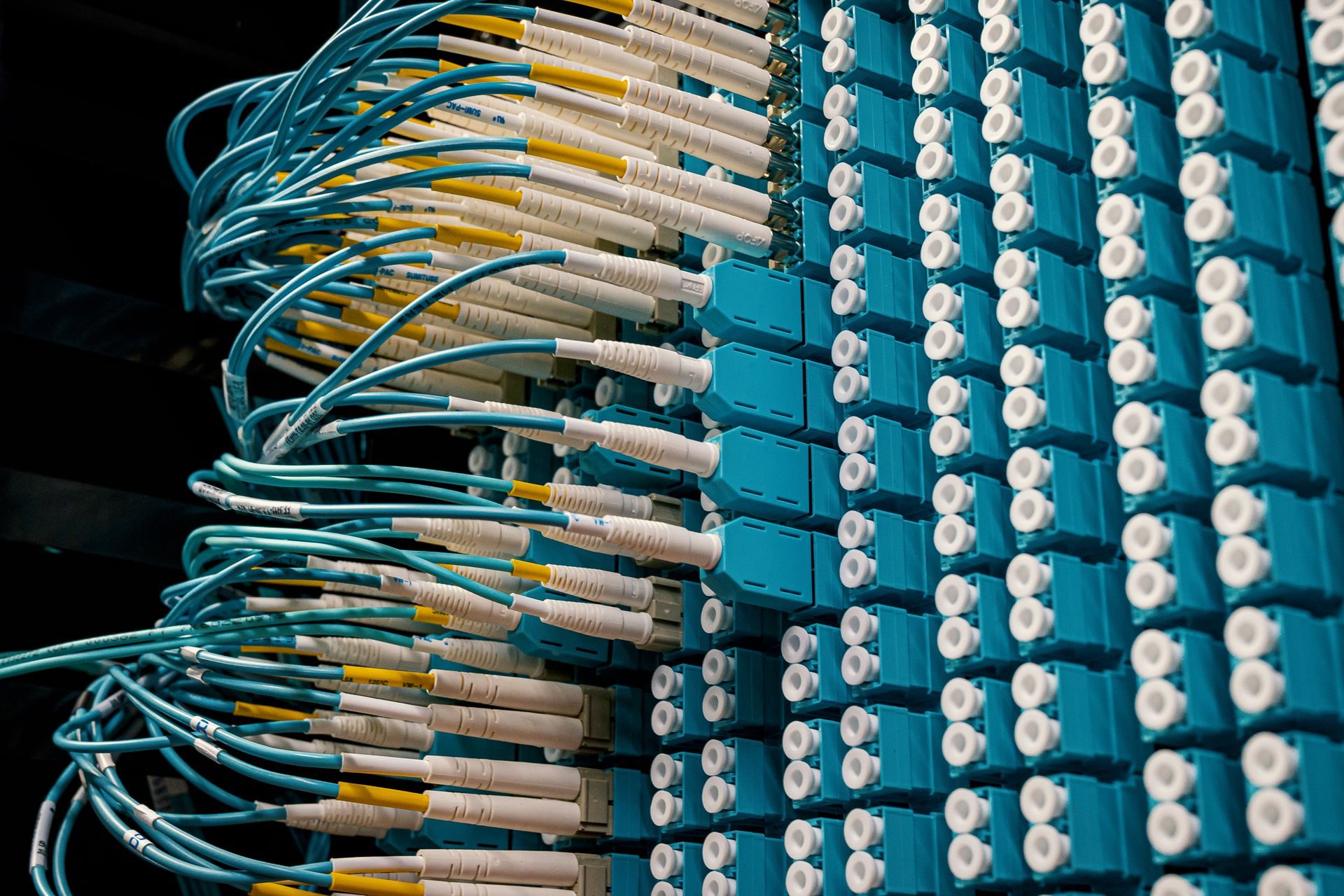 Patch cables plugged in patch panel, representing UCSTAK's Connectivity feature.