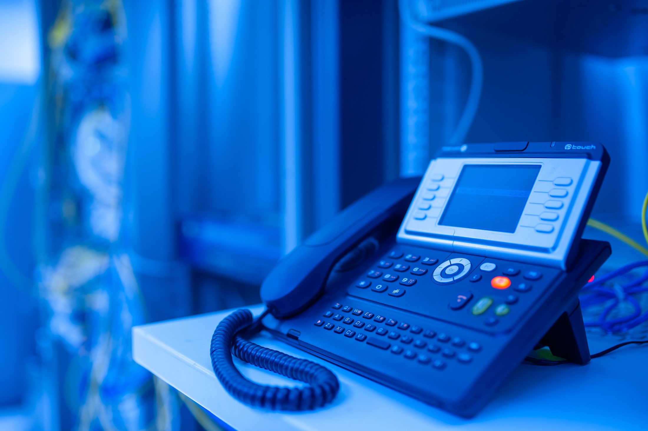 Ip Phone in Data Center Room Ip phone in data center room, representing UCSTAK's Distinctive Ringtones & Caller-ID Matching feature.
