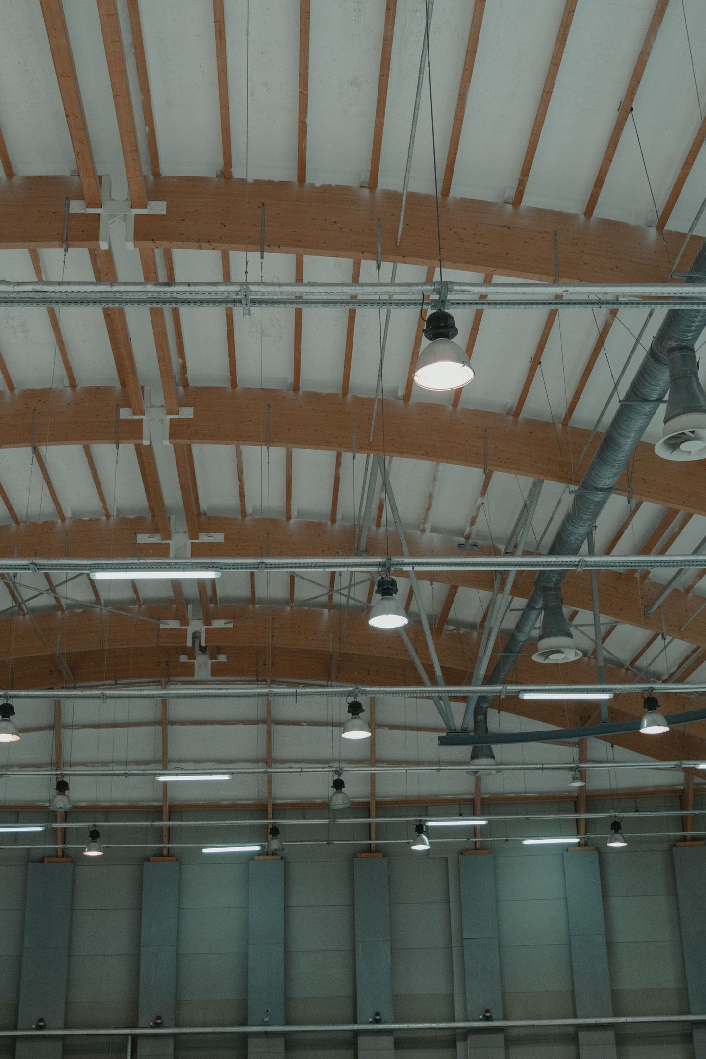 Pendant lamps hanging from ceiling, representing UCSTAK's Paging & Intercom feature.