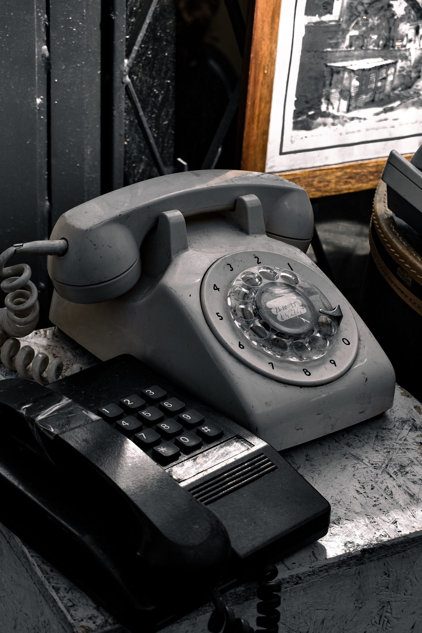 Vintage Rotary and Push Button Telephones Vintage rotary and push button telephones on desk, representing UCSTAK's Ring Count Before Reroute feature.