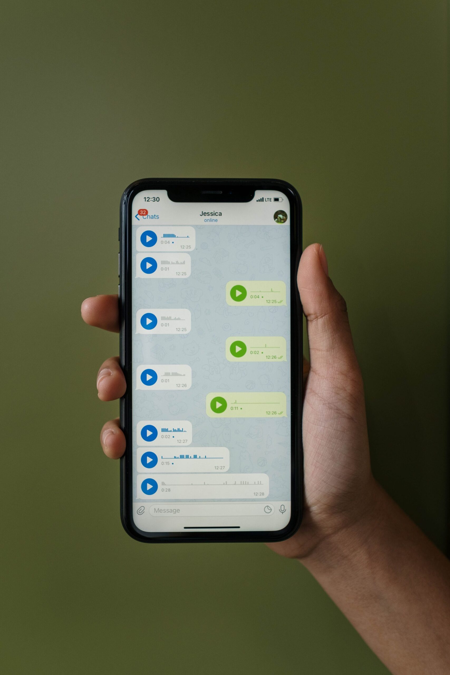 Close Up Shot of a Person Close up shot of a person holding a cellphone, representing UCSTAK's AI Voicemail Transcription feature.