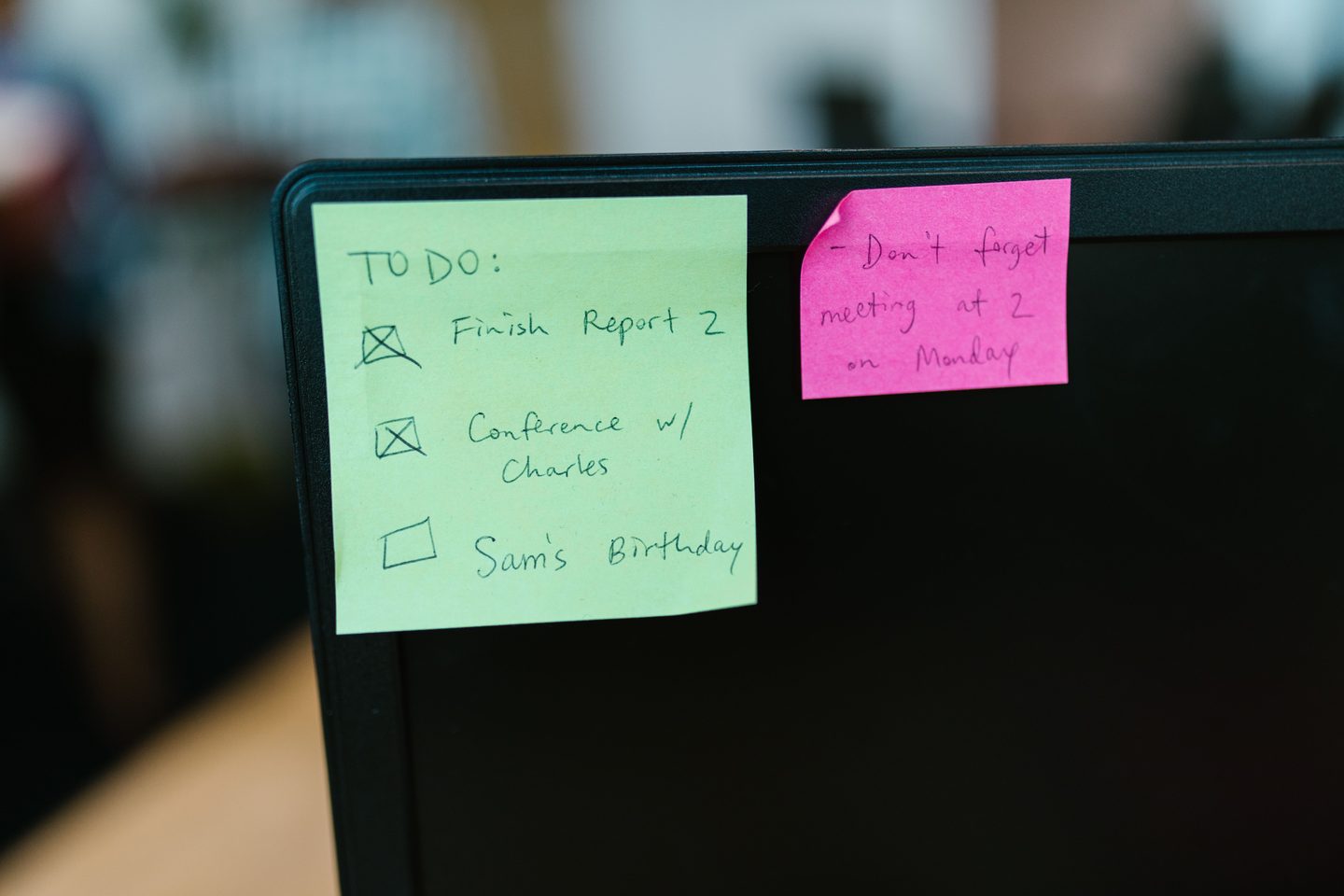 Sticky notes stuck on a monitor, representing UCSTAK's Department & Shared Voicemail Boxes feature.