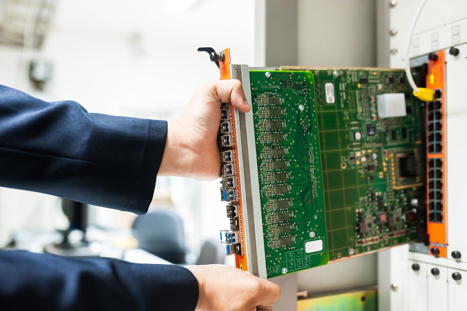 Engineer Fixing Core Switch in Data Engineer fixing core switch in data center room, representing UCSTAK's Hardware Expansion & Capacity Planning feature.