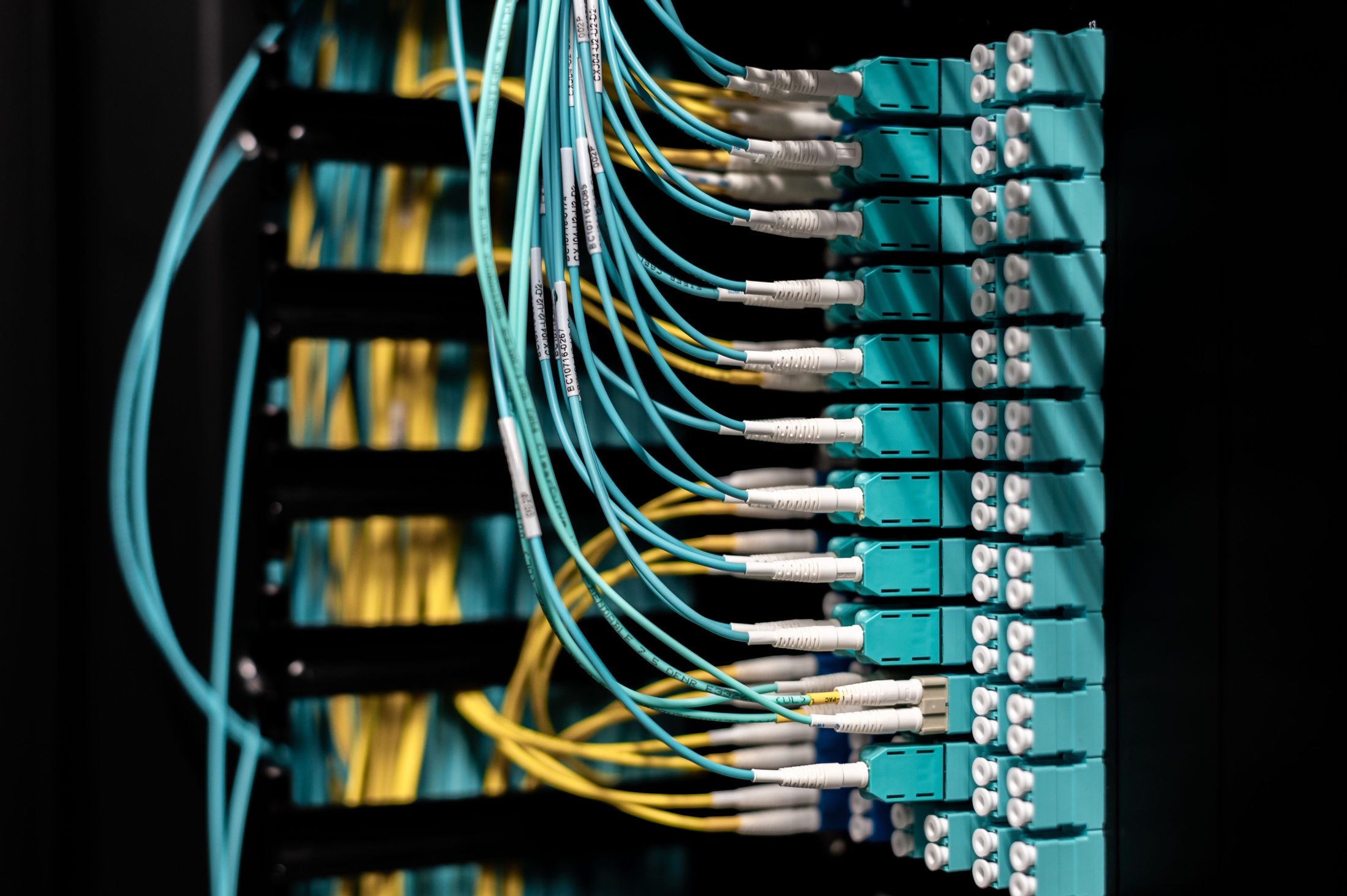 Organized Cables Plugged in Patch Panel Organized cables plugged in patch panel, representing UCSTAK's On-Site Appliance feature.