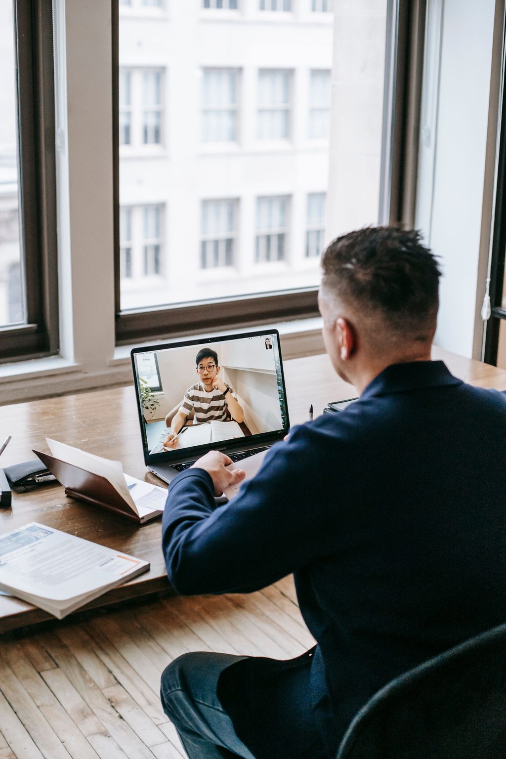 Photo of Man Using Laptop Photo of man using laptop, representing UCSTAK's Microsoft Teams & 365 Integration feature.