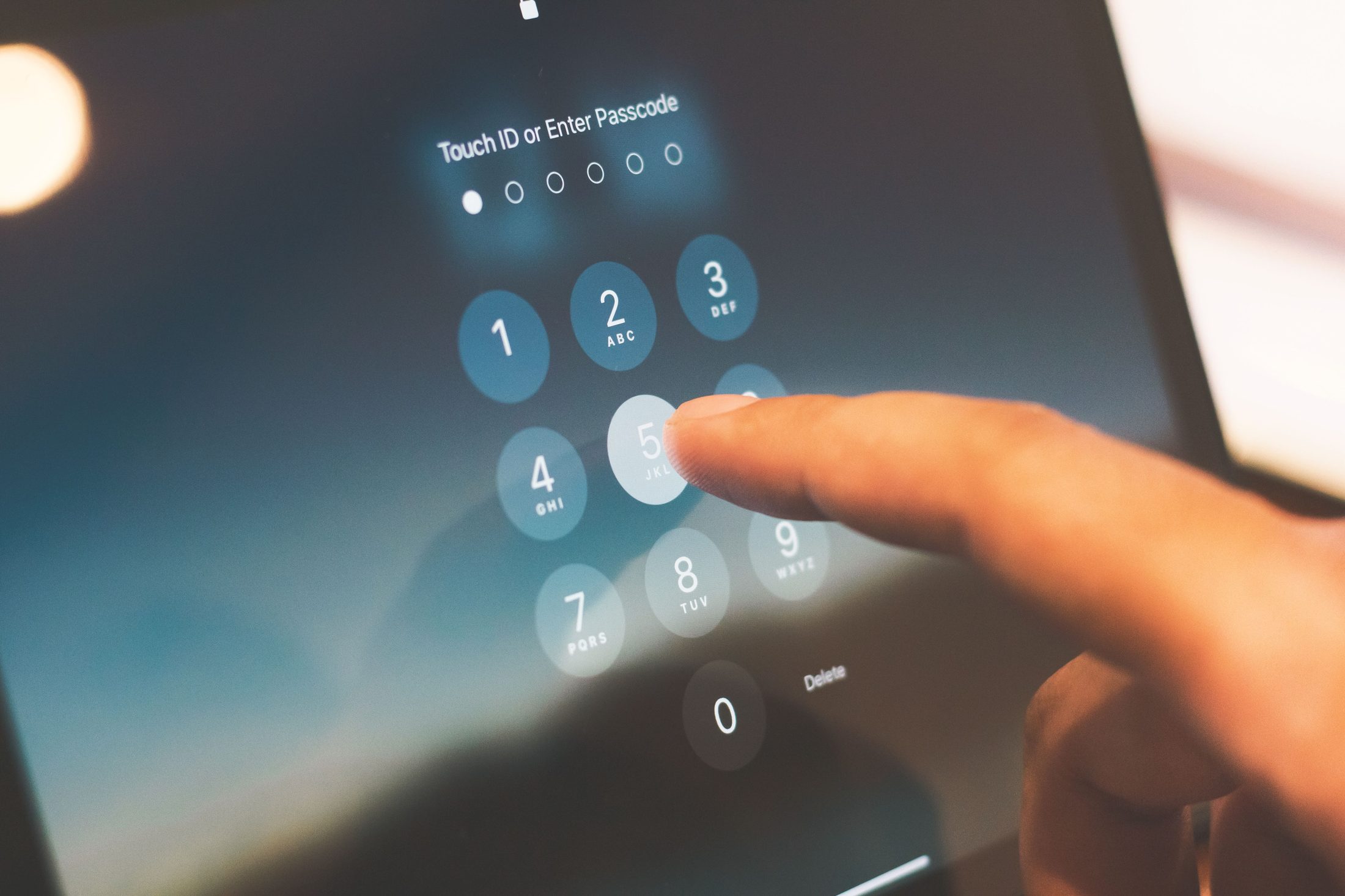 A Person S Finger is Touching A person s finger is touching a tablet screen, representing UCSTAK's Global Threat-Intelligence IP Blocklist feature.