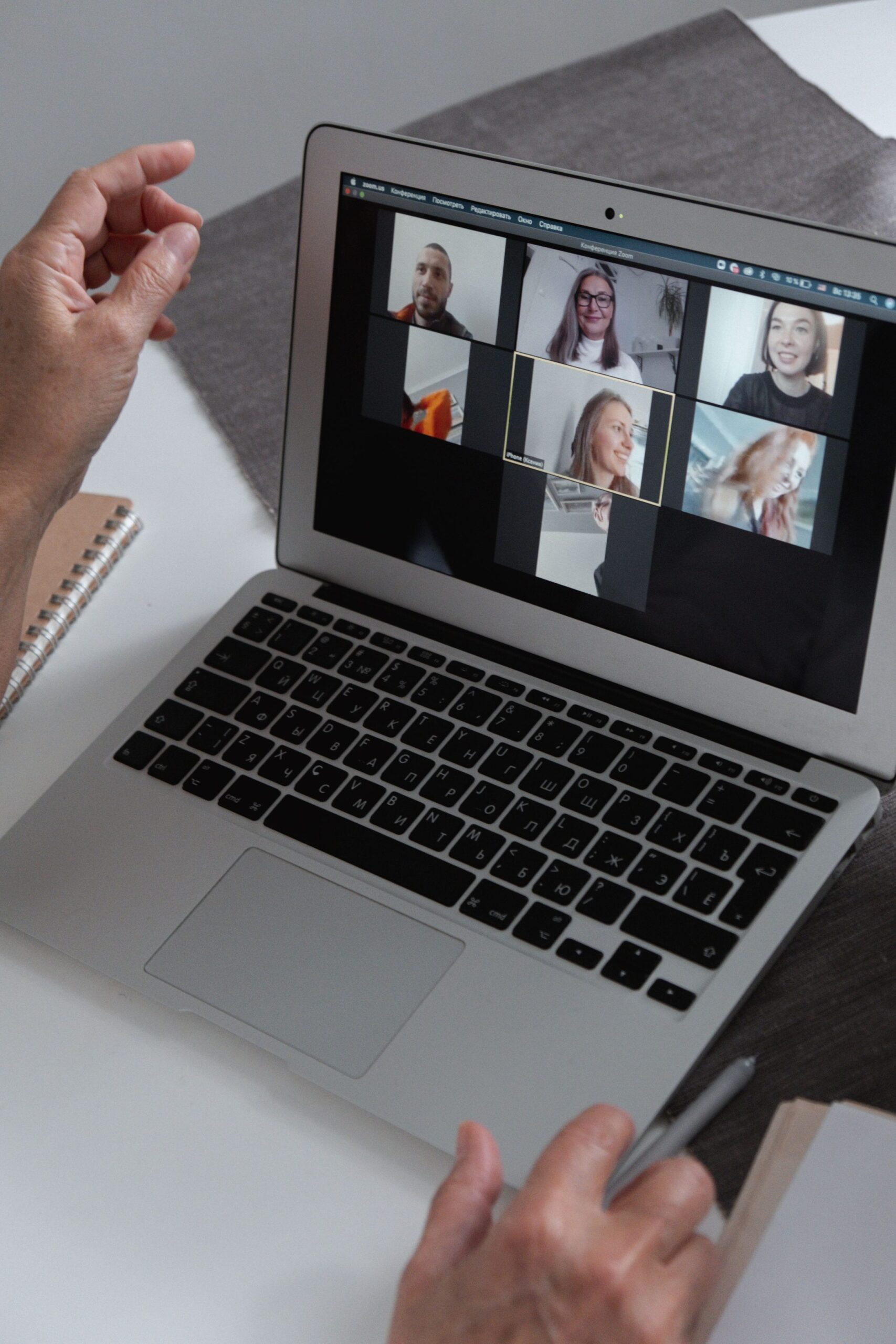 A group of people chatting in a video call in a laptop, representing UCSTAK's Real-Time Call Transcription feature.