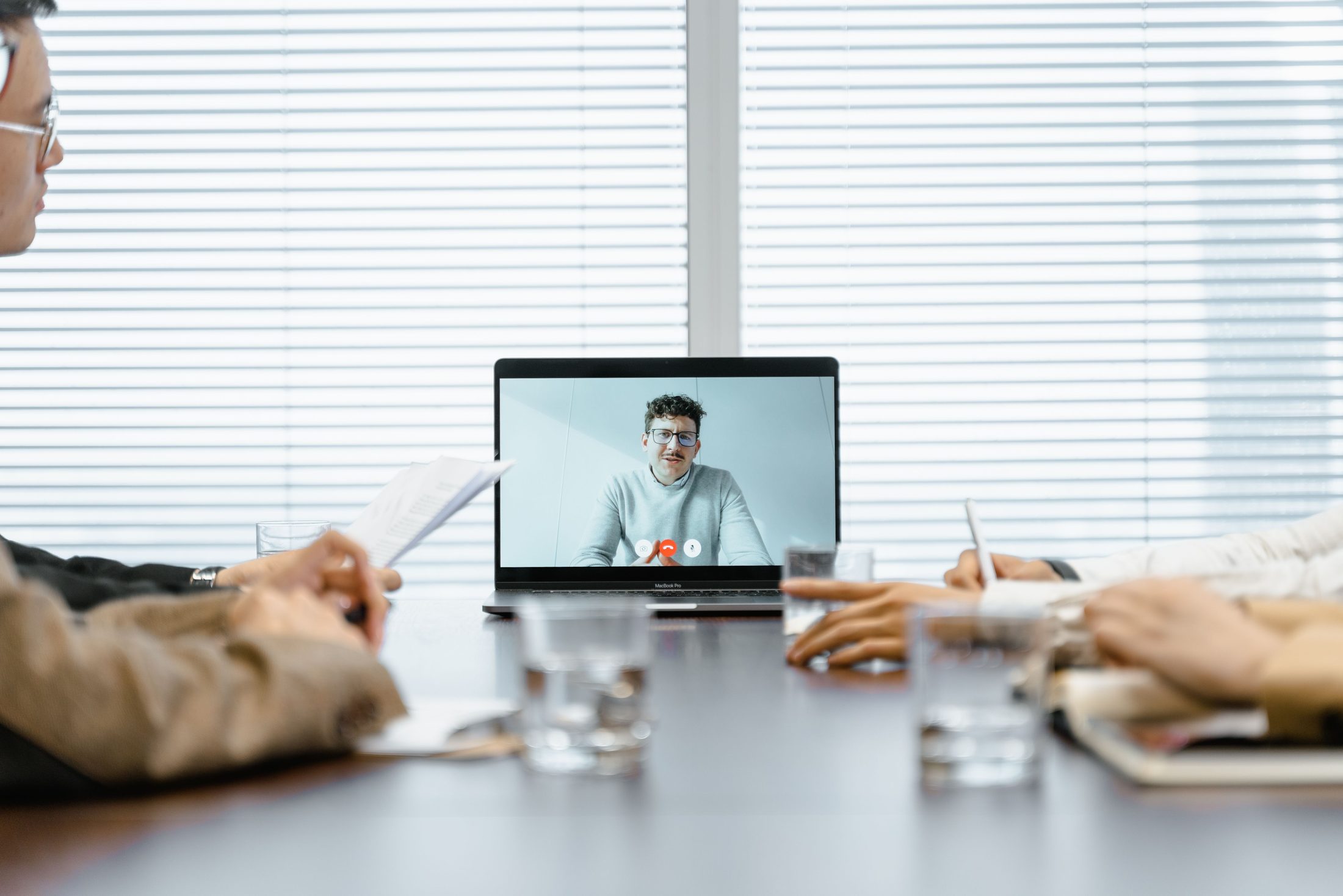 A Man Conducting a Meeting Virtually A man conducting a meeting virtually, representing UCSTAK's Video Conferencing feature.