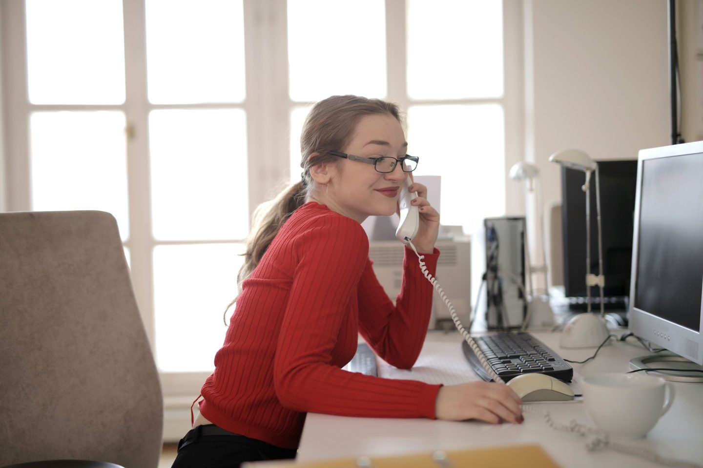 Woman talking on the phone on UCSTAK's Education page.