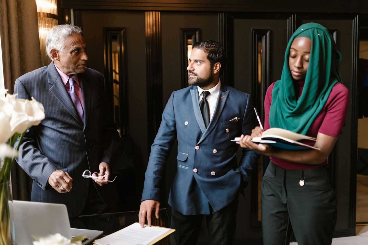 Diverse Business Professionals Collaborating A diverse group of business professionals collaborating, representing the industries we serve.